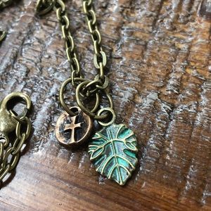 Bronze cross and patina leaf necklace